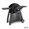 Barbacoa para cocinar en exterior de gas butano o propano con mesa deluxe color negro maca Weber